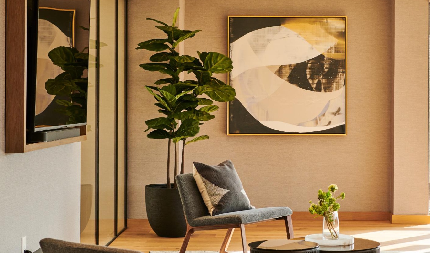 Find your perfect fit at Life Time Living Burlington a living room with a large painting