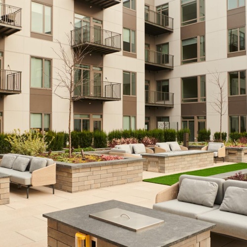 A perfect fit for the whole family a courtyard with a couch and chairs