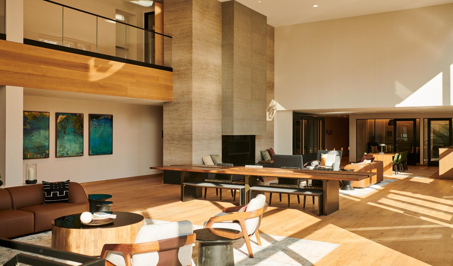 A perfect fit for the whole family a living room with a large stone fireplace